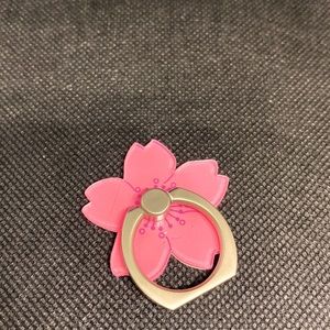 Pink flower with sliver phone ring.